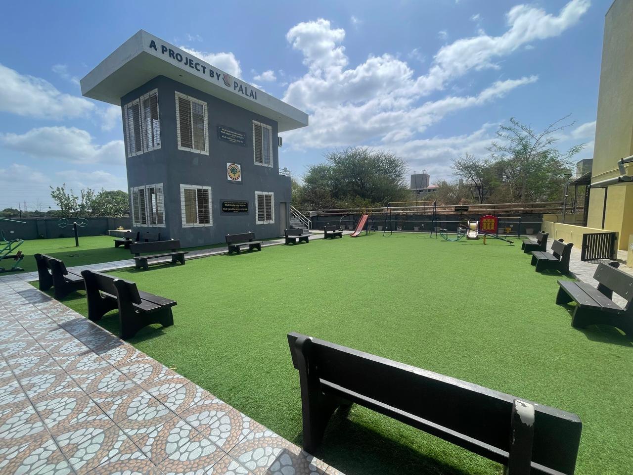 Landscaped garden and play area at the Devlali Dham